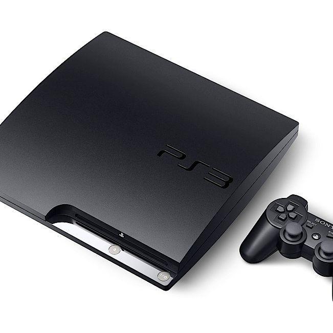 PlayStation 3 console beside a PC displaying the RPCS3 emulator interface.